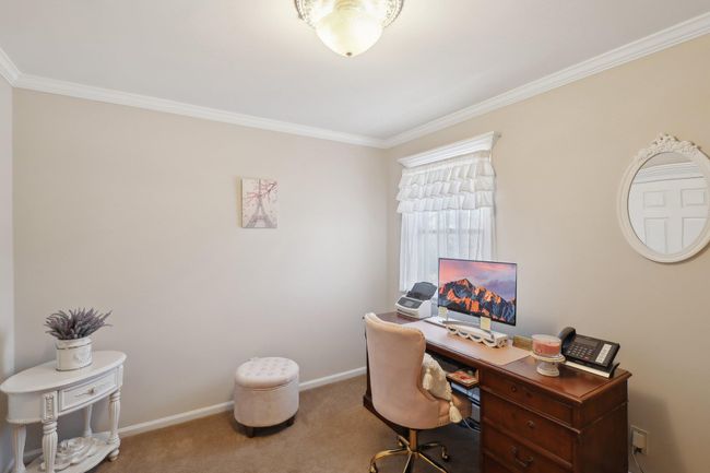 Carpeted office space featuring baseboards and ornamental molding | Image 24