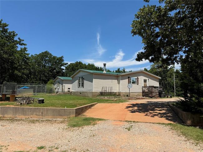 Manufactured / mobile home with a front yard | Image 24