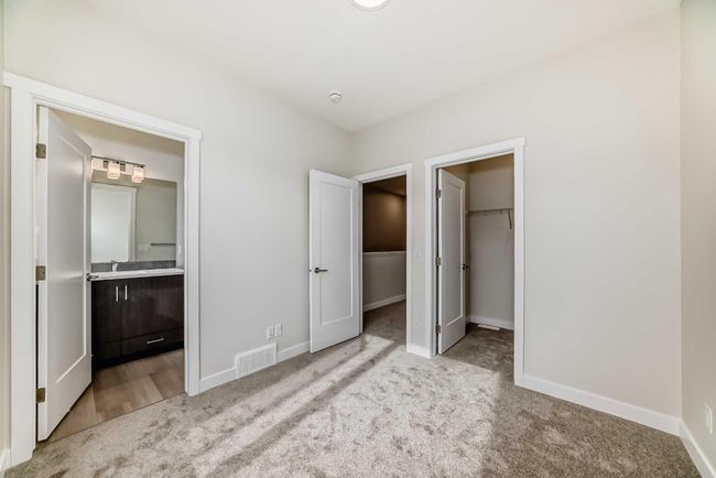 214 Shawnee Square Sw, Townhouse with 2 bedrooms, 3 bathrooms and 3 parking in Calgary AB | Image 34