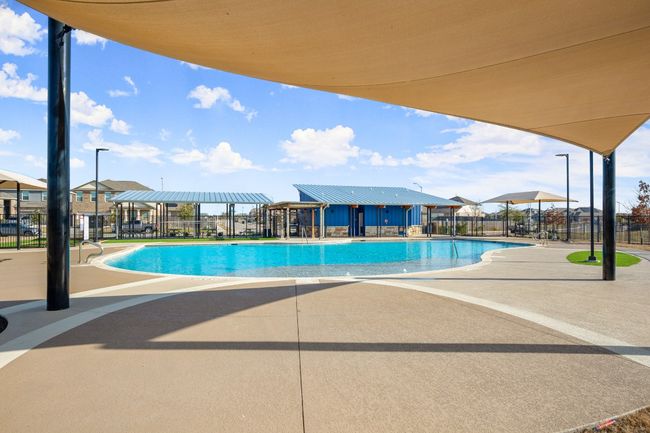 Pool with fence and a patio | Image 30