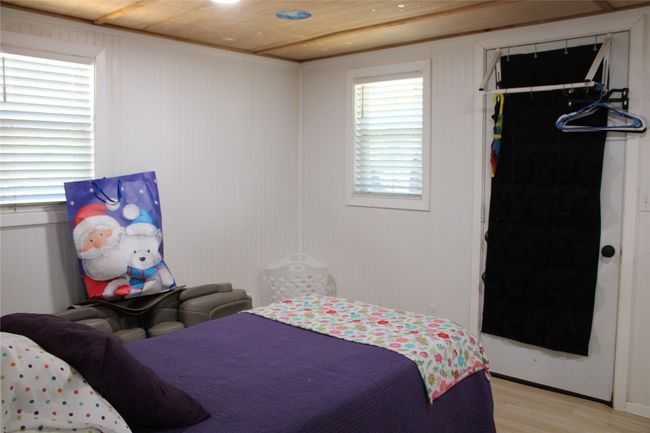 Bedroom with light wood-style floors, a closet, and a spacious closet | Image 6