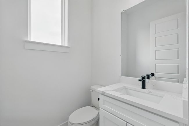 Bathroom featuring vanity and toilet | Image 8