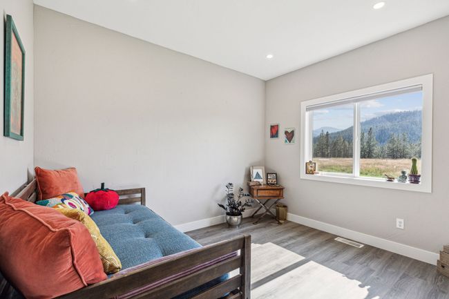 Bedroom with baseboards, wood finished floors, recessed lighting, and a mountain view | Image 29