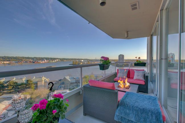 Balcony featuring an outdoor fire pit and a water view | Image 12