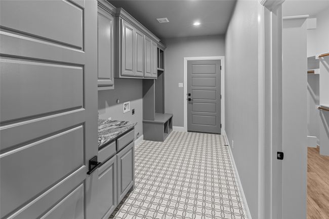 Laundry area with hookup for a washing machine, cabinet space, electric dryer hookup, and recessed lighting | Image 14