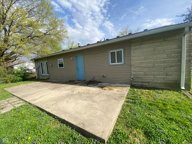 back of property featuring a lawn and a patio | Image 16