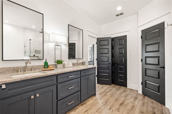 Bathroom with double vanity, a walk in shower, and wood finished floors | Image 24