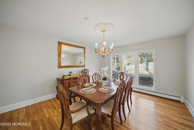 Dining Room w hardwood floors, large windows and adjacent to eat in kitchen | Image 18