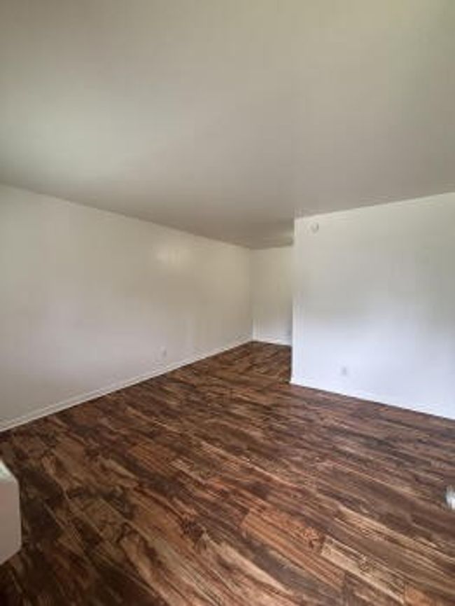Unfurnished room featuring dark wood-style floors | Image 7