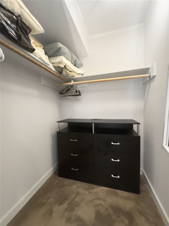 View of walk in closet | Image 18