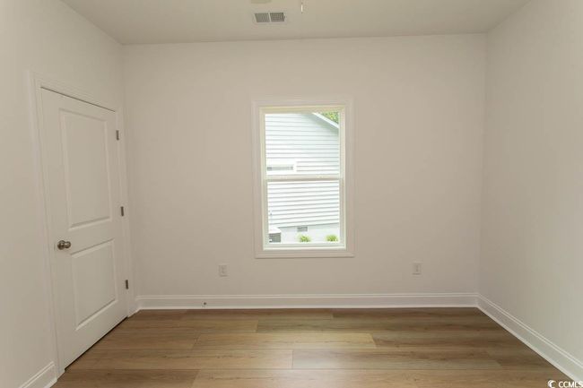 Unfurnished room with light wood-style flooring and baseboards | Image 13