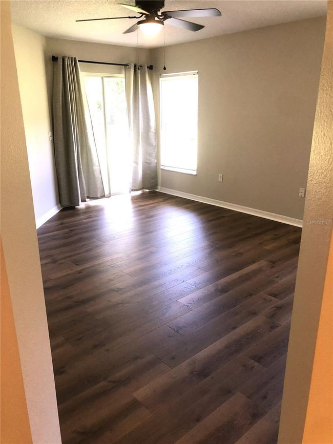 PRIMARY BEDROOM WITH BLINDS OPEN | Image 12