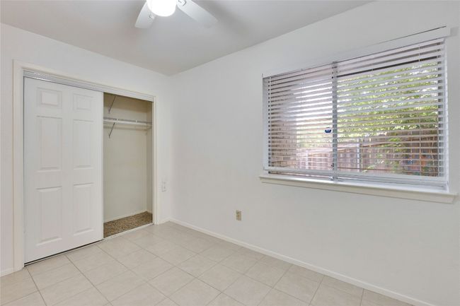 Unfurnished bedroom featuring a closet and a ceiling fan | Image 20