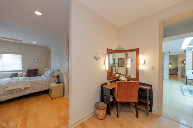 Primary Bedroom dressing area with built-in vanity featuring recessed lighting and light wood-style flooring | Image 27