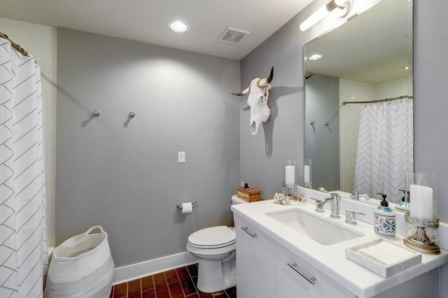 Full bath featuring vanity, toilet, baseboards, a shower with shower curtain, and recessed lighting | Image 15