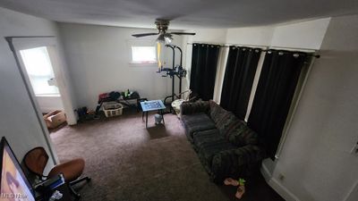 Carpeted living room featuring ceiling fan | Image 2