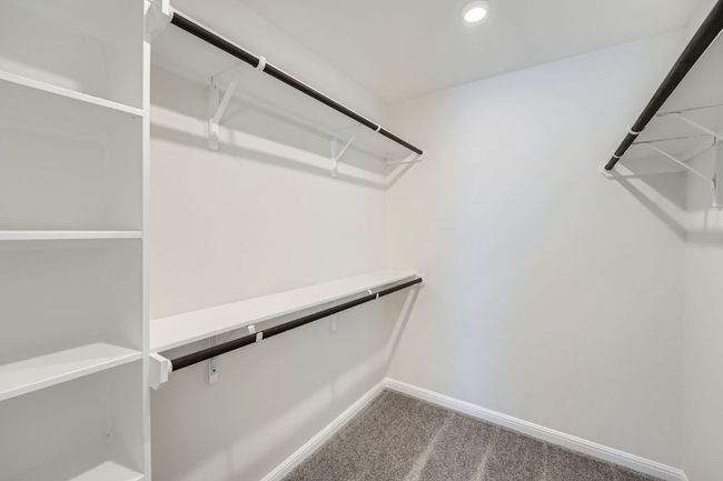 Spacious closet featuring carpet floors | Image 22