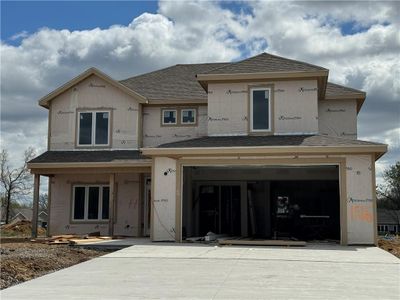 View of front facade featuring a garage | Image 1