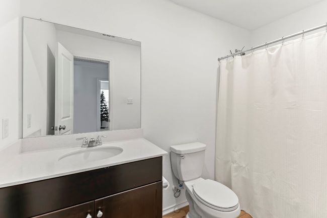 Bathroom featuring vanity and a shower with shower curtain | Image 25