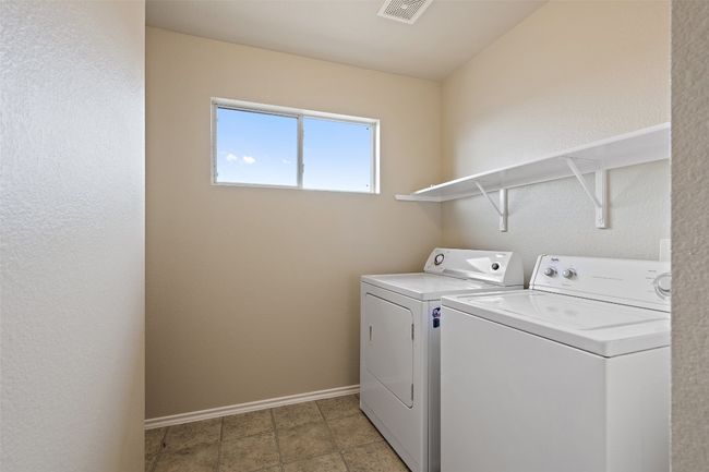 Washroom with washer and clothes dryer and baseboards | Image 31