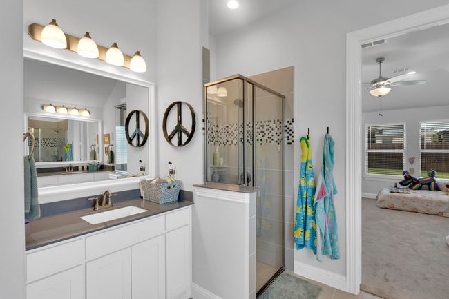 Full bath featuring vanity, a bath, vaulted ceiling, tile patterned floors, and a shower stall | Image 19