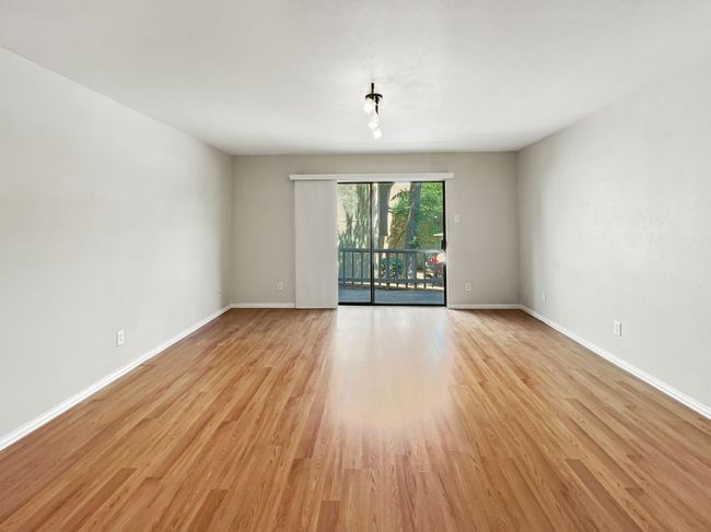 Empty room featuring light wood-type flooring and baseboards | Image 7
