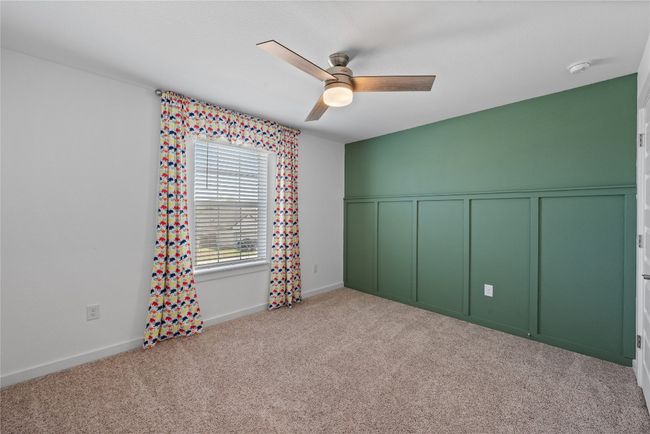 Carpeted spare room with a ceiling fan | Image 26