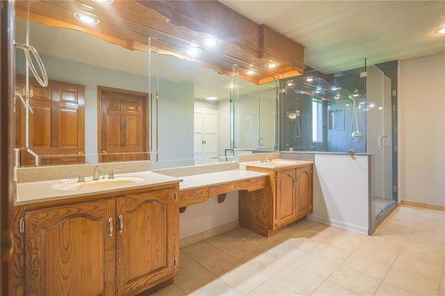 Double sink and ceramic floors and shower | Image 23