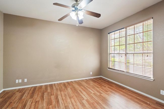 Spare room that can be an office, study or bedroom with a ceiling fan | Image 6