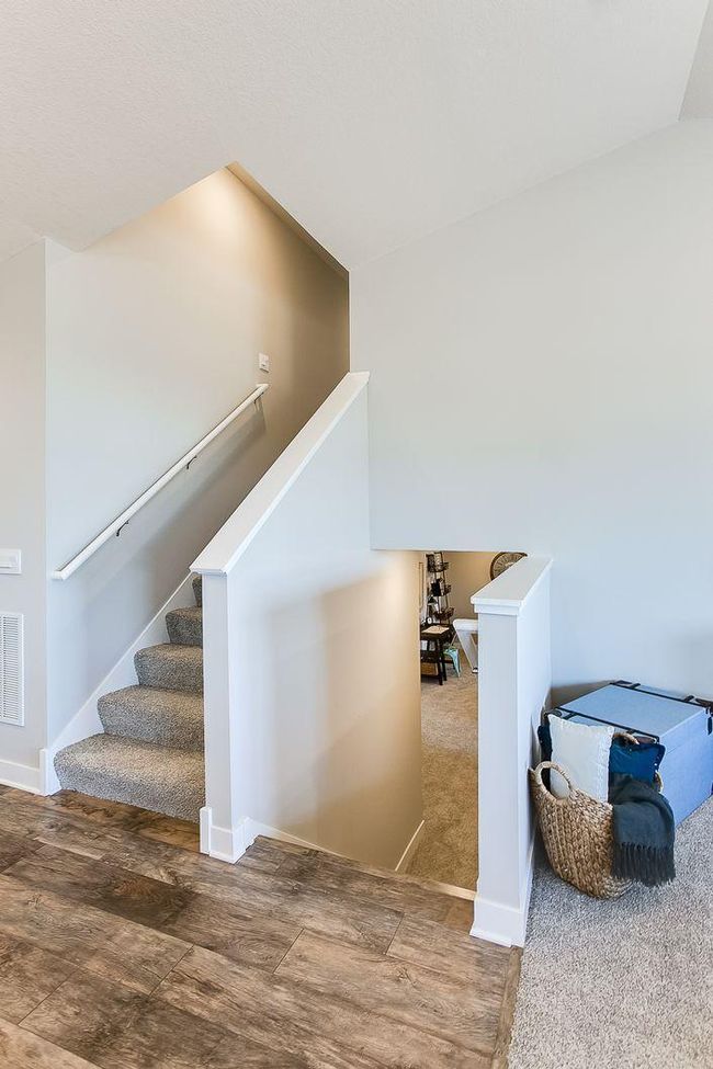 Just seven small steps to the finished lower-level rec room! Photos of model home. Colors and options may vary. Ask Sales Agent for details. | Image 30