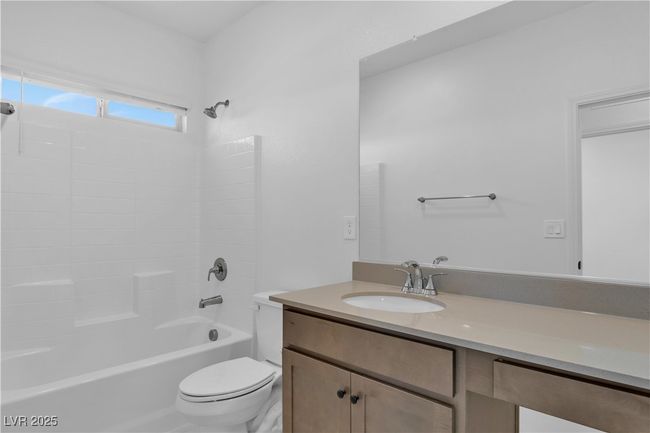 Bathroom with toilet, shower / bathtub combination, and vanity | Image 15