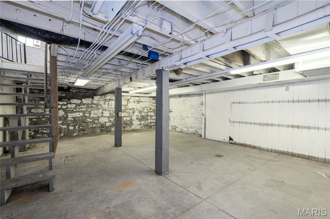 View of unfinished basement for storage. | Image 9