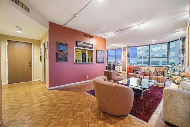 The wide front entry is just off the kitchen and living area. | Image 7