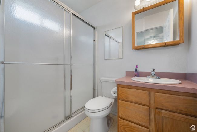 Bathroom with vanity and a stall shower | Image 15