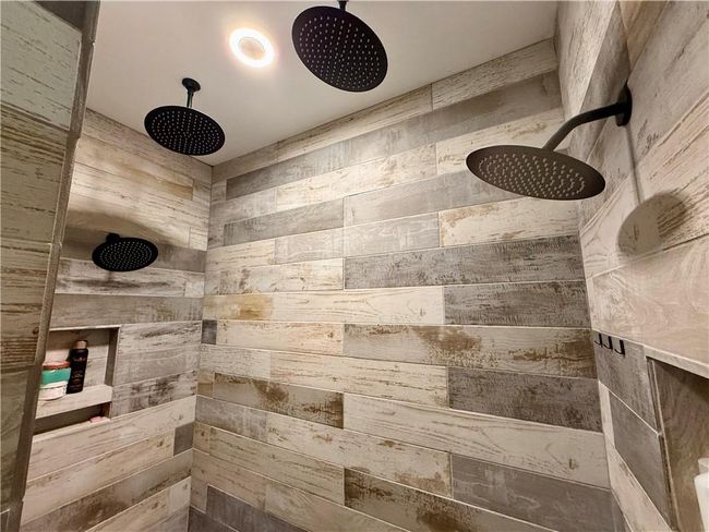 The rain shower features in this spa like shower are incredible. | Image 29
