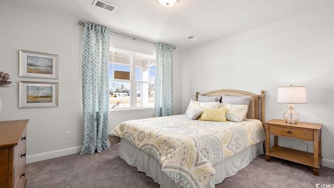 Carpeted bedroom featuring baseboards | Image 23