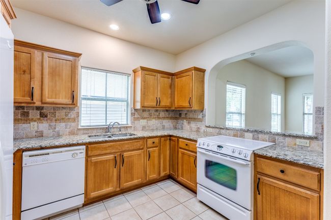 Kitchen featuring white appliances, ceiling fan, arched walkways, plenty of natural light, and recessed​​‌​​​​‌​​‌‌​‌‌​​​‌‌​​‌‌​‌​​​​​‌ lighting | Image 12
