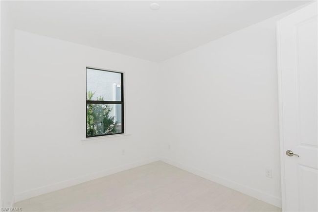 Spare room with baseboards | Image 12