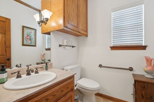 Bathroom with toilet and vanity | Image 10