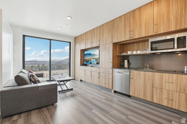 Living room featuring recessed lighting and light wood-style flooring | Image 5