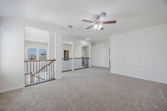 Carpeted spare room with a ceiling fan and baseboards | Image 16