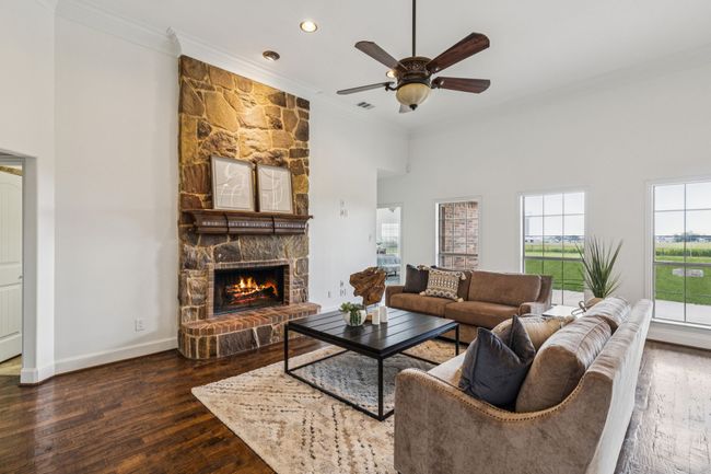 Main living area featuring a stone fireplace | Image 8
