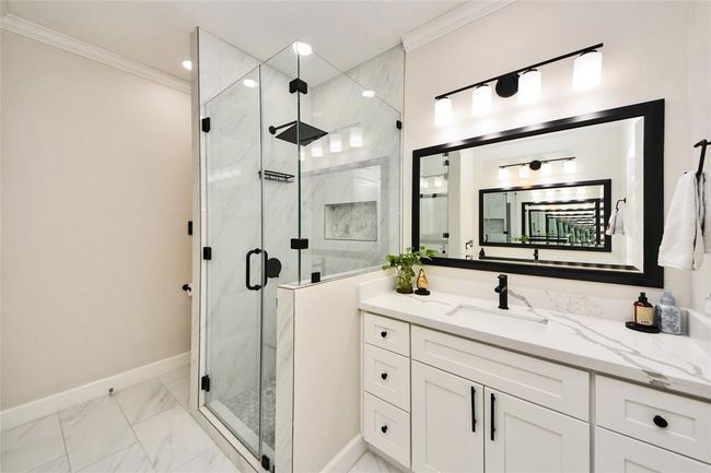 New lighting, walk-in shower, and beautiful flooring. | Image 18
