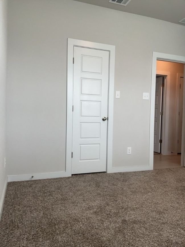 Carpeted empty room with baseboards | Image 26