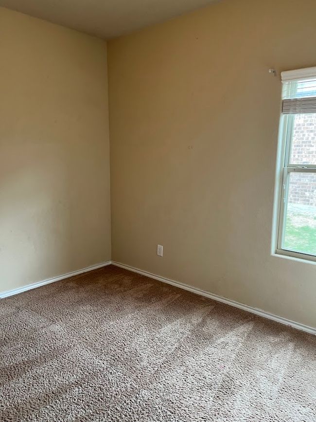 Carpeted empty room featuring baseboards | Image 14