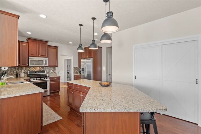 Start you day with a hot cup of coffee at the oversized kitchen island. | Image 12