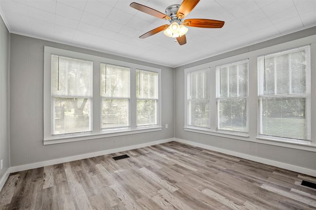 View of unfurnished sunroom | Image 10