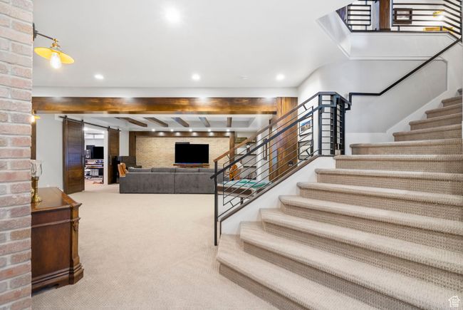 Staircase with carpet flooring, recessed lighting, and a barn door | Image 65