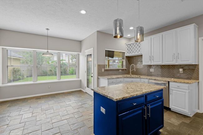 Again, the natural light throughout the home adds joy, especially in the kitchen with plenty of counterspace and storage! | Image 8