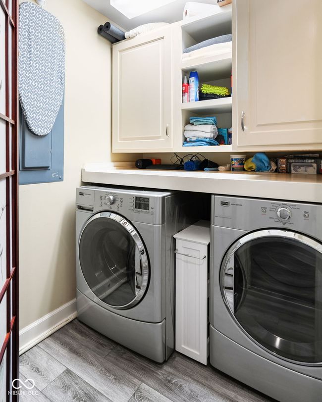 Laundry room has ample storage | Image 25